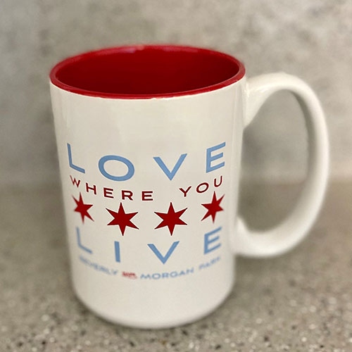 Product Description: Enjoy your favorite hotbeverage inour Chicago-inspired mug, designed to perfectly complement your love for the city and our Beverly/Morgan Park community with BAPA's motto "Love Where You Live." Thismug adds a touch of Windy City charm to every sip.</br> "Love Where You Live" Mug